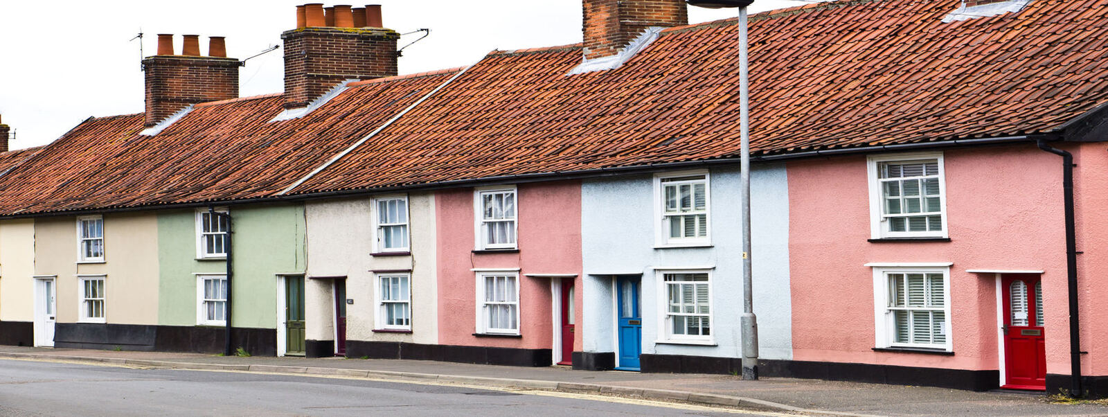 Terrace of colourful cottages with pantile roofs